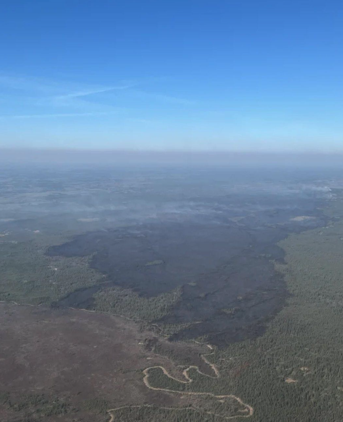 <who> Photo credit: Canadian Press </who> A massive swathe of burned forest is seen as a wildfire designated MWF017 by the Alberta Wildfire Service, top right, continues to burn near Ft. McMurray, Alta., in a Saturday, May 11, 2024, handout photo. 