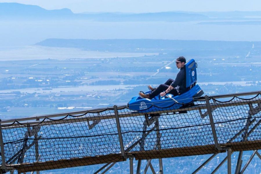 <who>Photo Credit: Grouse Mountain</who>A rider enjoys the views on the new Grouse Gravity Coaster, a Grouse Mountain attraction that officially opened May 20.