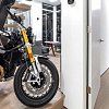 Hey, why's a BMW motorcycle parked in the middle of this spectacular penthouse condo?